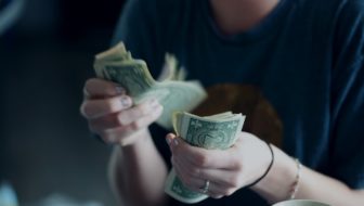 A woman counting money.