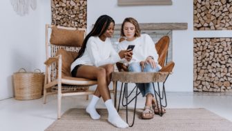 Two women discussing about business.