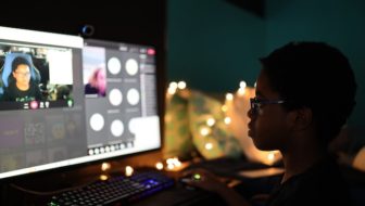 A woman attending a virtual event.