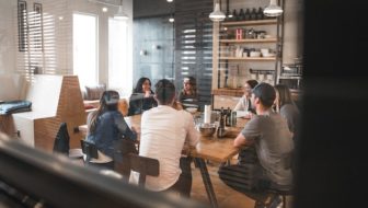 A team of employees sitting in a well furnished office.