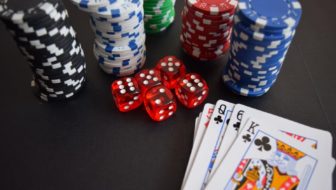 Coins, Dice and cards for casino games.