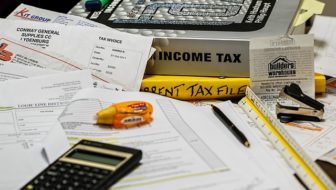 Income tax documents and a calculator.